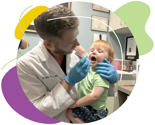 Dr Curtis examining a young patient