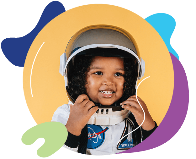 Young girl smiling in a astronaut suit